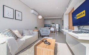 Living room open to kitchen - Modern Stay Recoleta with Balcony, Pool&City Views (Asunción)