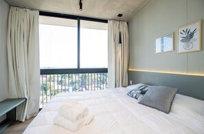 Bedroom with panoramic window view - Spacious Stay with Balcony, City Views & Pool BBQ (Asunción)