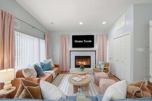 Sink into plush seating and let the glow of the fireplace melt the day away. Cozy evenings, easy conversation and room for everyone to stretch out and unwind together. - Fort Walton Fun | Pool, Hot Tub, Games & Firepit (Fort Walton Beach)