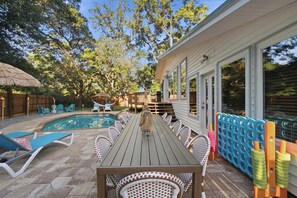 Big groups will love this alfresco dining setup, with plenty of seating and oversized games close at hand. Eat, play, and laugh together with the pool as your backdrop. - Fort Walton Fun | Pool, Hot Tub, Games & Firepit (Fort Walton Beach)