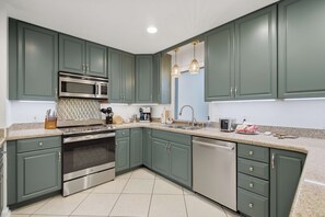 Cook up your favorite recipes in a kitchen that has everything you need. Stainless appliances and plenty of counter space make meal prep easy, so more of your time goes to enjoying the trip. - Fort Walton Fun | Pool, Hot Tub, Games & Firepit (Fort Walton Beach)