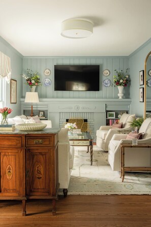 Living Room: A bright and welcoming living room with comfortable seating and a relaxed atmosphere, offering the perfect spot to unwind, chat, or enjoy a quiet evening.
