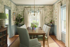 Dining Area: Share good food and conversation in this inviting dining space, thoughtfully arranged for comfortable meals and memorable moments with your group.
