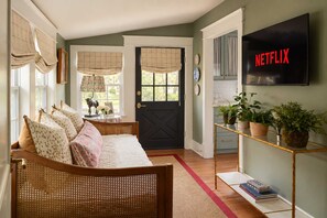 Living Room: A bright and welcoming living room with comfortable seating and a relaxed atmosphere, offering the perfect spot to unwind, chat, or enjoy a quiet evening.