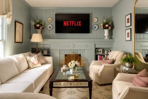 Living Room: A bright and welcoming living room with comfortable seating and a relaxed atmosphere, offering the perfect spot to unwind, chat, or enjoy a quiet evening.