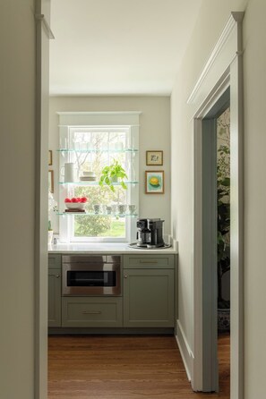 Kitchen: Cook and gather in this bright, well-equipped kitchen featuring generous counter space, essential appliances, and everything needed for easy meals during your stay. - Little Light cozy home near Downtown Louisville! (Louisville)