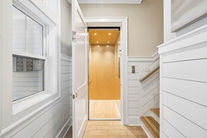 Your private elevator makes every floor of your home effortlessly accessible, blending modern convenience with stylish light wood finishes and recessed lighting for a warm, welcoming touch. - Private Pool | Gulf Views | Elevator (Santa Rosa Beach)