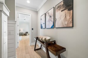 Soft gray walls and warm wood tones welcome you home in this thoughtfully designed hallway, where modern artistry meets coastal charm. - Private Pool | Gulf Views | Elevator (Santa Rosa Beach)