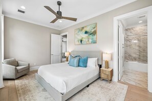 Drift into relaxation in your serene bedroom, where soft linens, coastal touches, and a ceiling fan create your perfect retreat. Your private en-suite awaits through the door to your right. - Private Pool | Gulf Views | Elevator (Santa Rosa Beach)