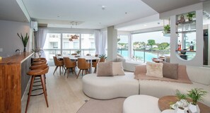 Open living and dining area with lagoon view