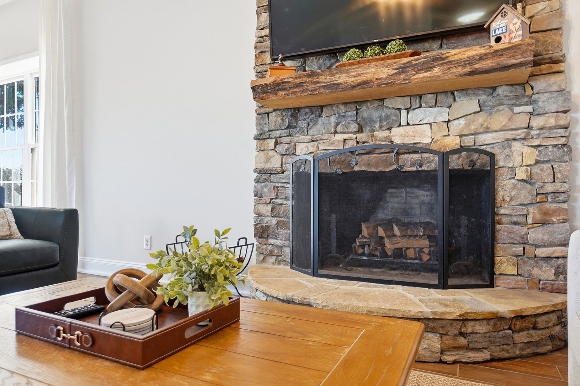 The beautiful stone fireplace adds so much character to the main living space and gives it that cozy lake-house feel.