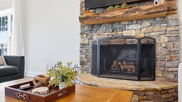 The beautiful stone fireplace adds so much character to the main living space and gives it that cozy lake-house feel.