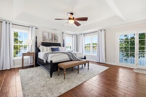 Welcome to the primary suite; king bed, tons of natural light and Lake Tillery right outside your windows. - Lakefront retreat with dock, kayaks & firepit (Albemarle)