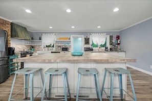 Spacious modern kitchen with oversized island and seating for four - Cozy 3BR Decatur Unit w/ EV Charger (Decatur)