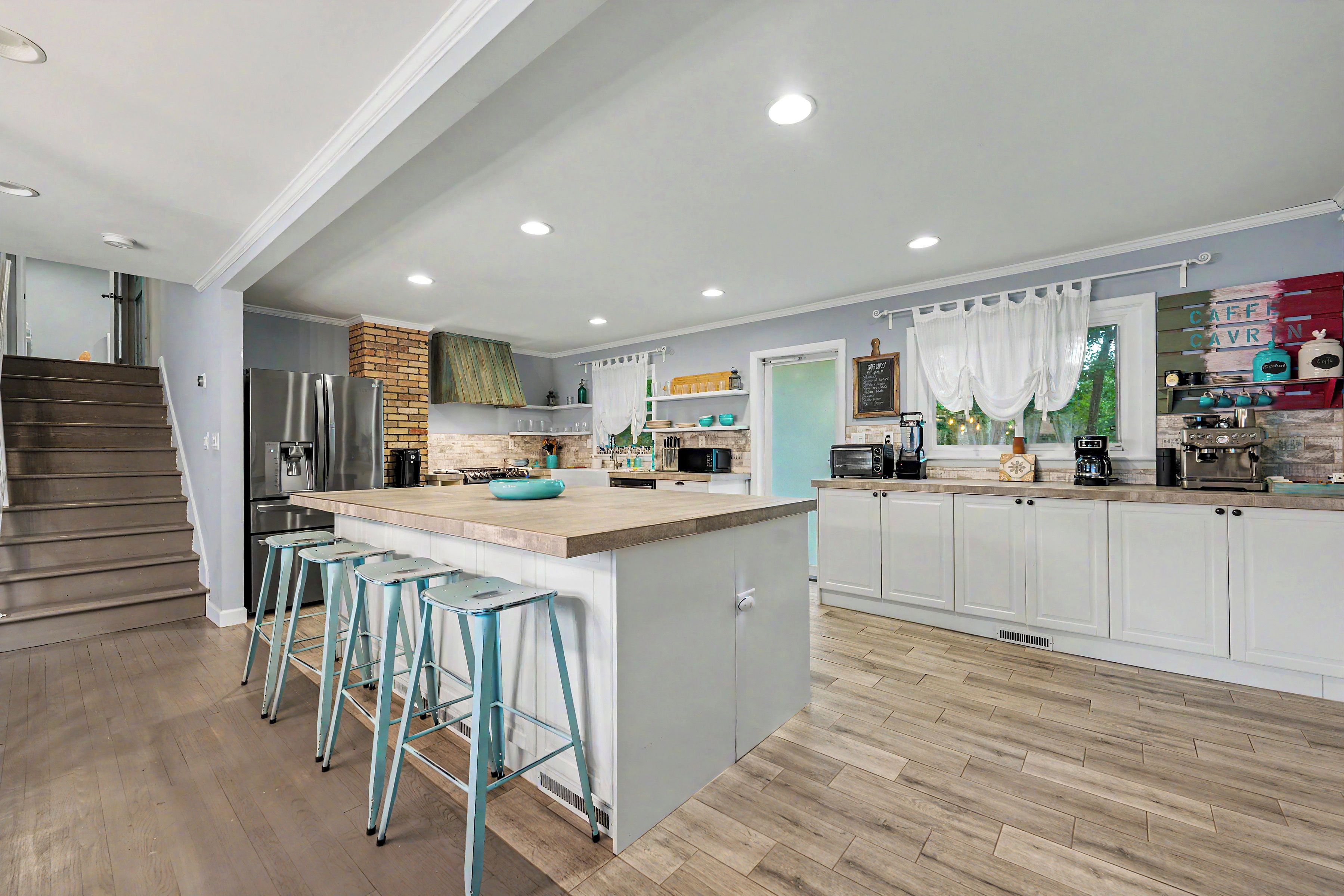 Bright modern kitchen with large island seating and stylish coffee bar