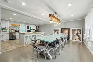 Spacious farmhouse dining area with large table, bar seating, and bright kitchen - Cozy 3BR Decatur Unit w/ EV Charger (Decatur)