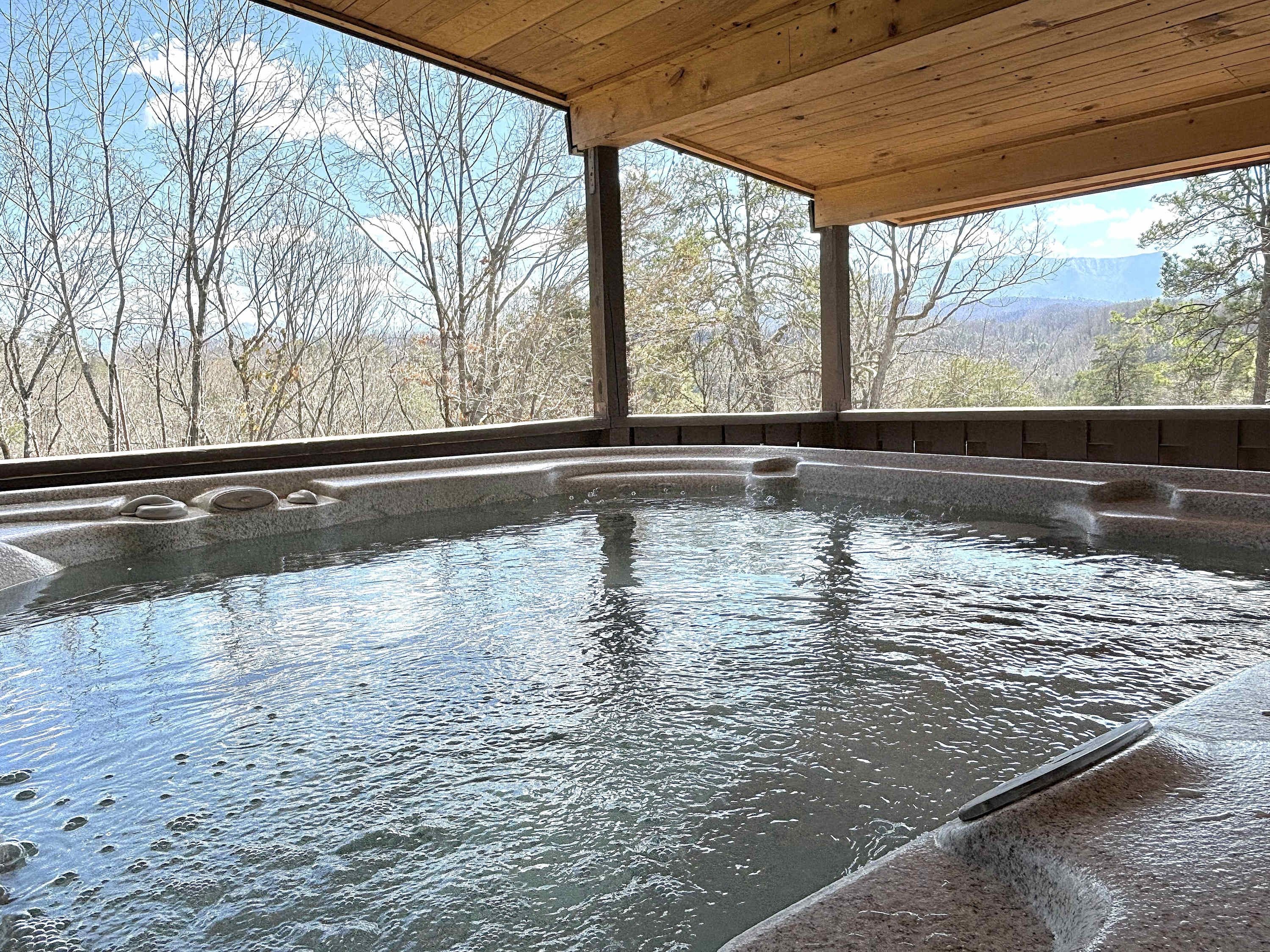 Large 4 seater hot tub with mountain views. 