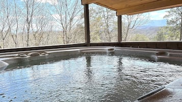 Large 4 seater hot tub with mountain views.