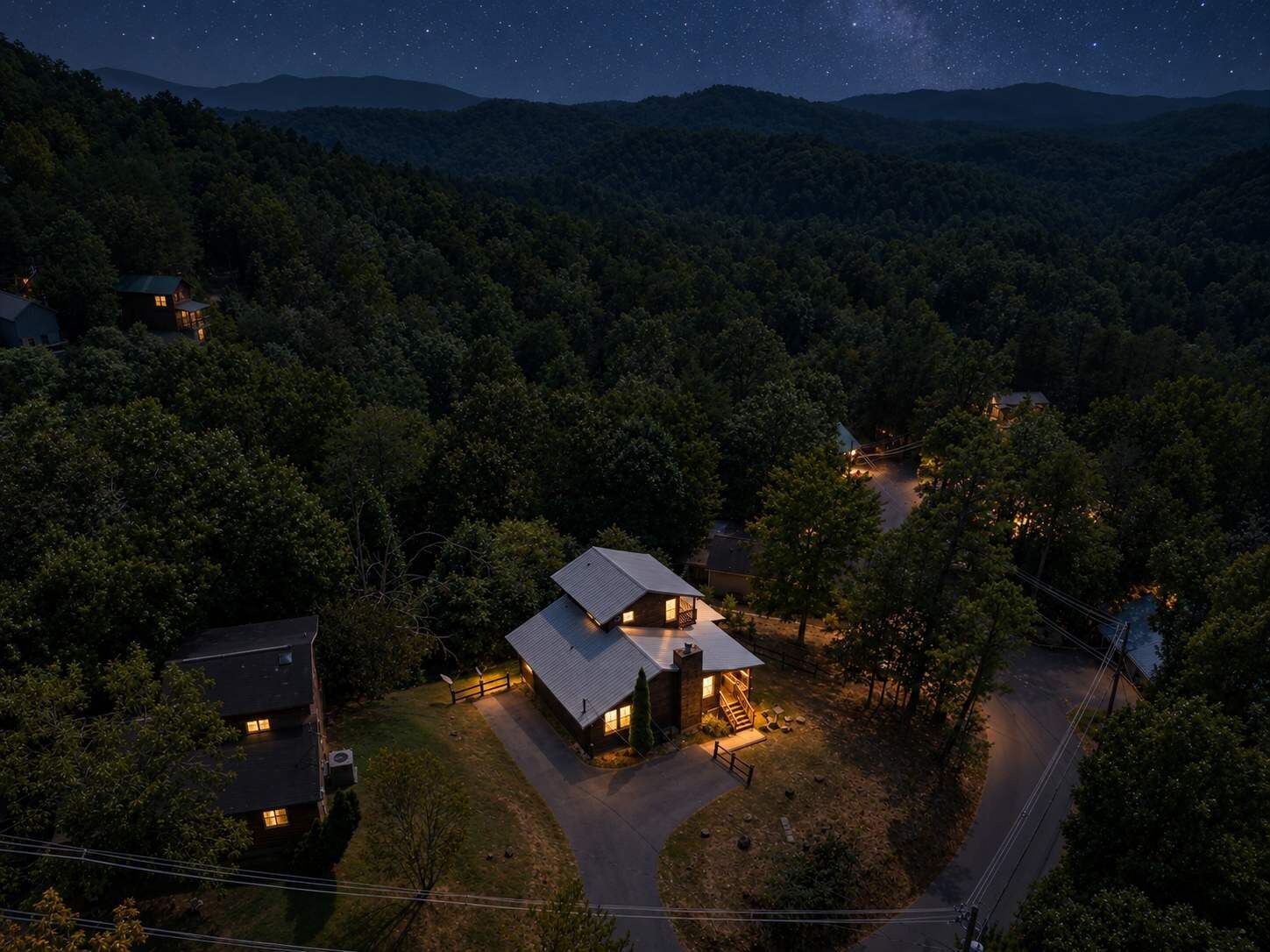 Twilight aerial of cabin. 