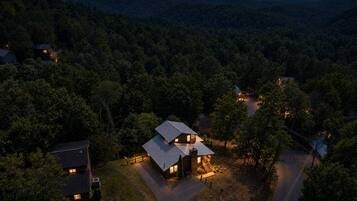 Twilight aerial of cabin.