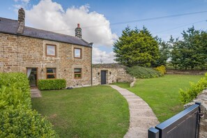 A stone house with a paved driveway leading to a grassy yard. - 2 Bed in Greenhow Hill (oc-h46025) (Greenhow Hill)
