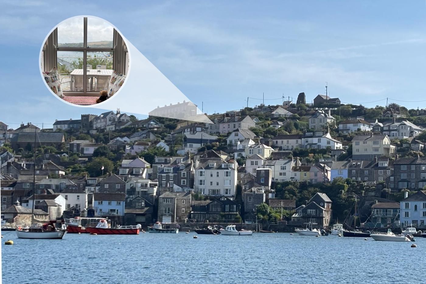 A coastal town with a view of the sea and boats.