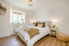A bedroom with a bed, bedside table, lamp, and a window. - 1 Bed in Trevelmond (oc-46051) (Trevelmond)
