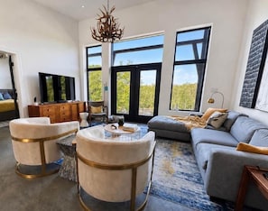 Light-filled living room overlooking the river