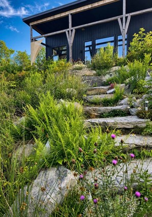 Custom stone stairway leading towards the river