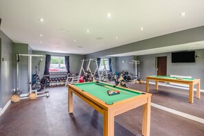 A multi-purpose room with a pool table, exercise equipment, and a television. - 5 Bed in Potto (oc-t46322) (Potto)