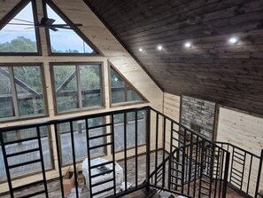 A wooden interior with a staircase, large windows, and a view of the outdoors. - Brand New !! - Coming between Nov 23rd - Dec 1st, 2026. Check back soon!! (Smithville)