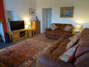 A living room with a sofa set, a television, a cabinet, and a rug. - 2 Bed in Sandyhills (oc-d546062) (Southwick)