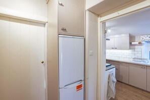A compact kitchen with a white refrigerator, a sink, and a tiled backsplash. - 8 Bed in New Galloway (oc-d594998) (New Galloway)