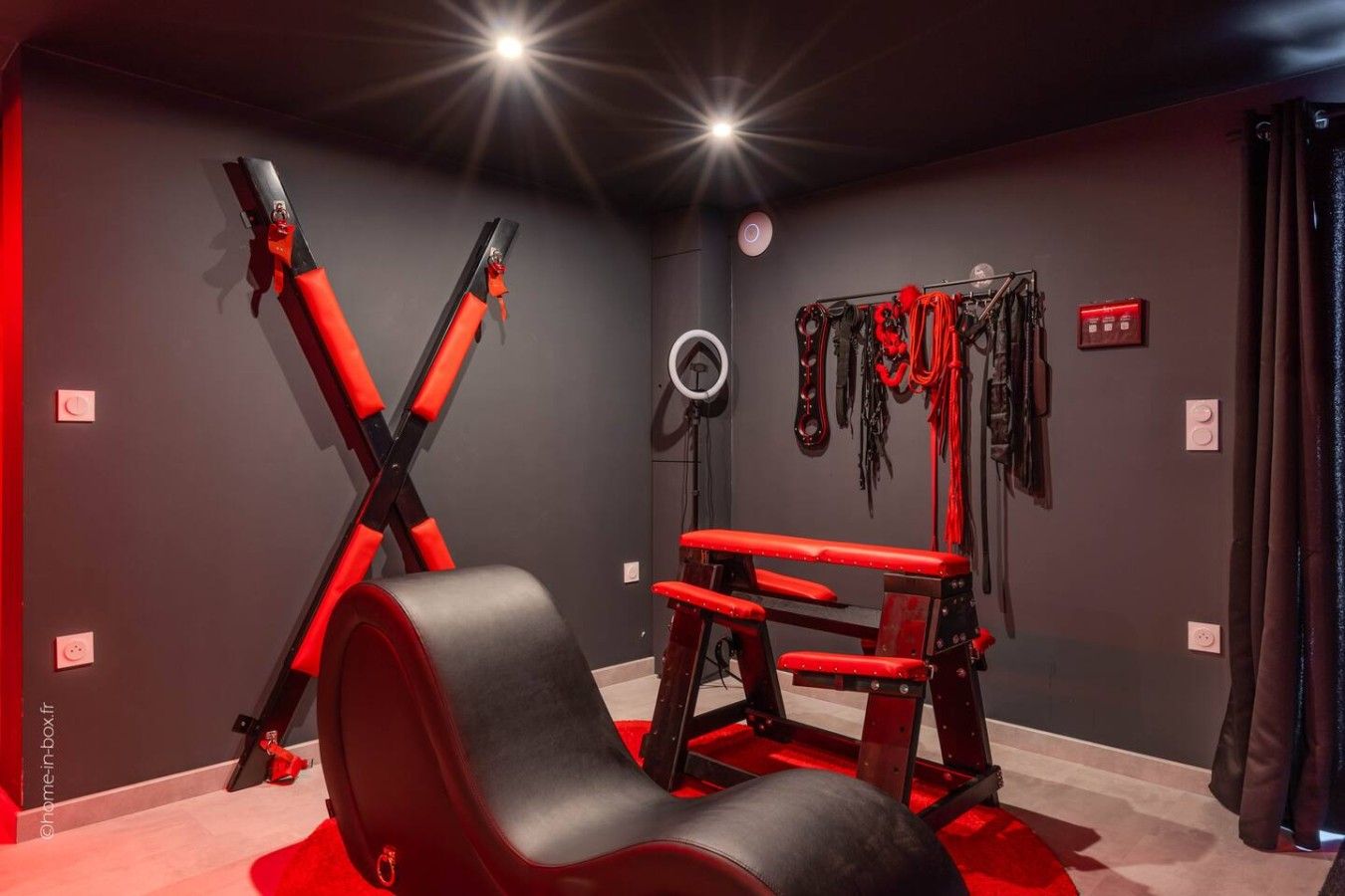 A gym with exercise equipment, including a bench and weightlifting machines.