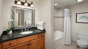 A bathroom with a sink, mirror, and toilet. - Stunning Resort Stay-Studio-Marriott's Shadow Ridge Villages (Palm Desert)
