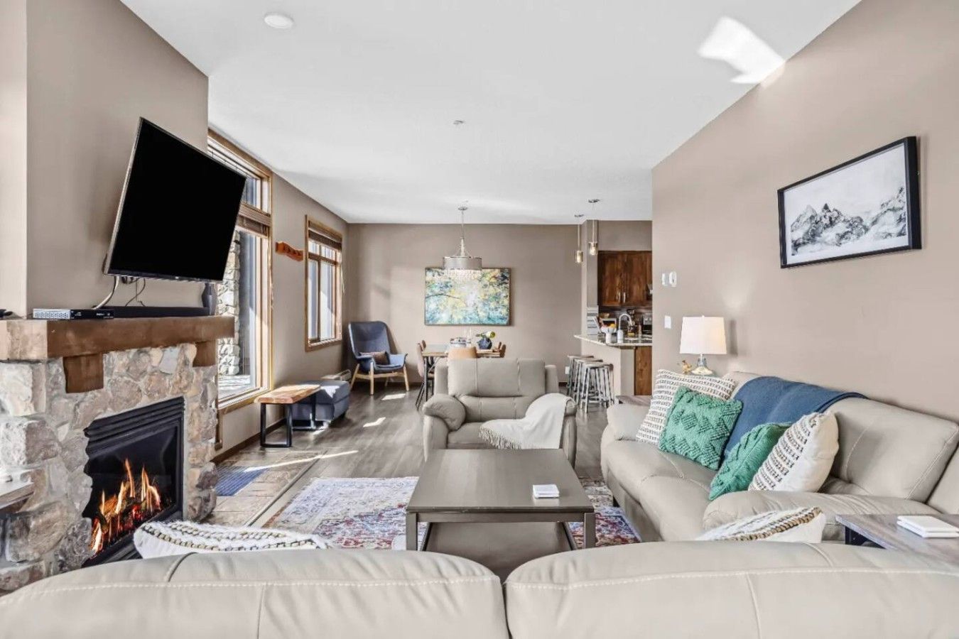 A living room with a fireplace, a television, and a sofa.