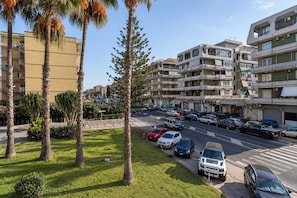 A multi-story parking garage with several cars parked.