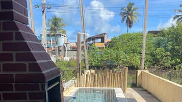 A swimming pool with a brick structure and a water filtration system.