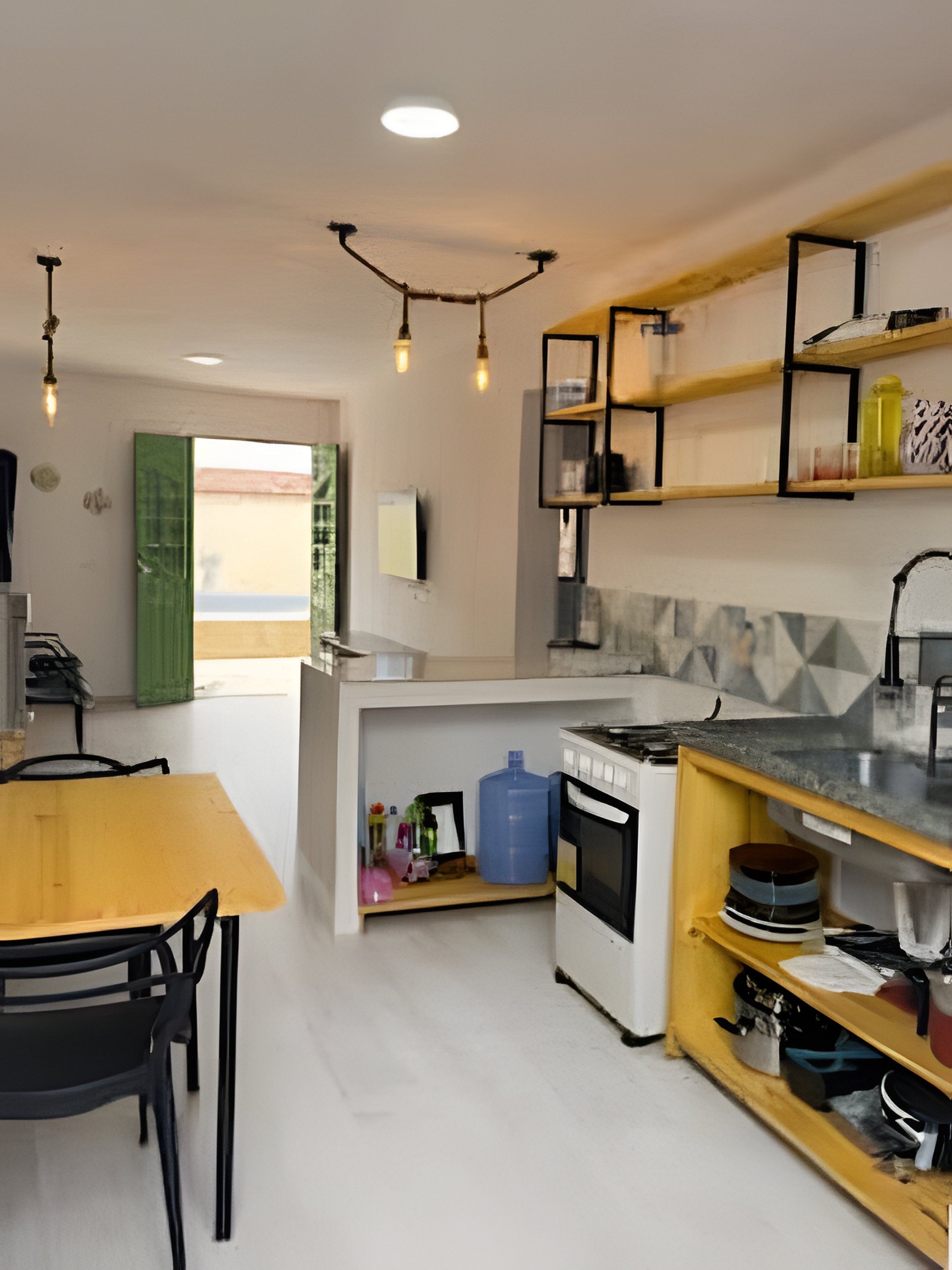 A modern kitchen with a dining table, chairs, a built-in oven, and a large water dispenser.