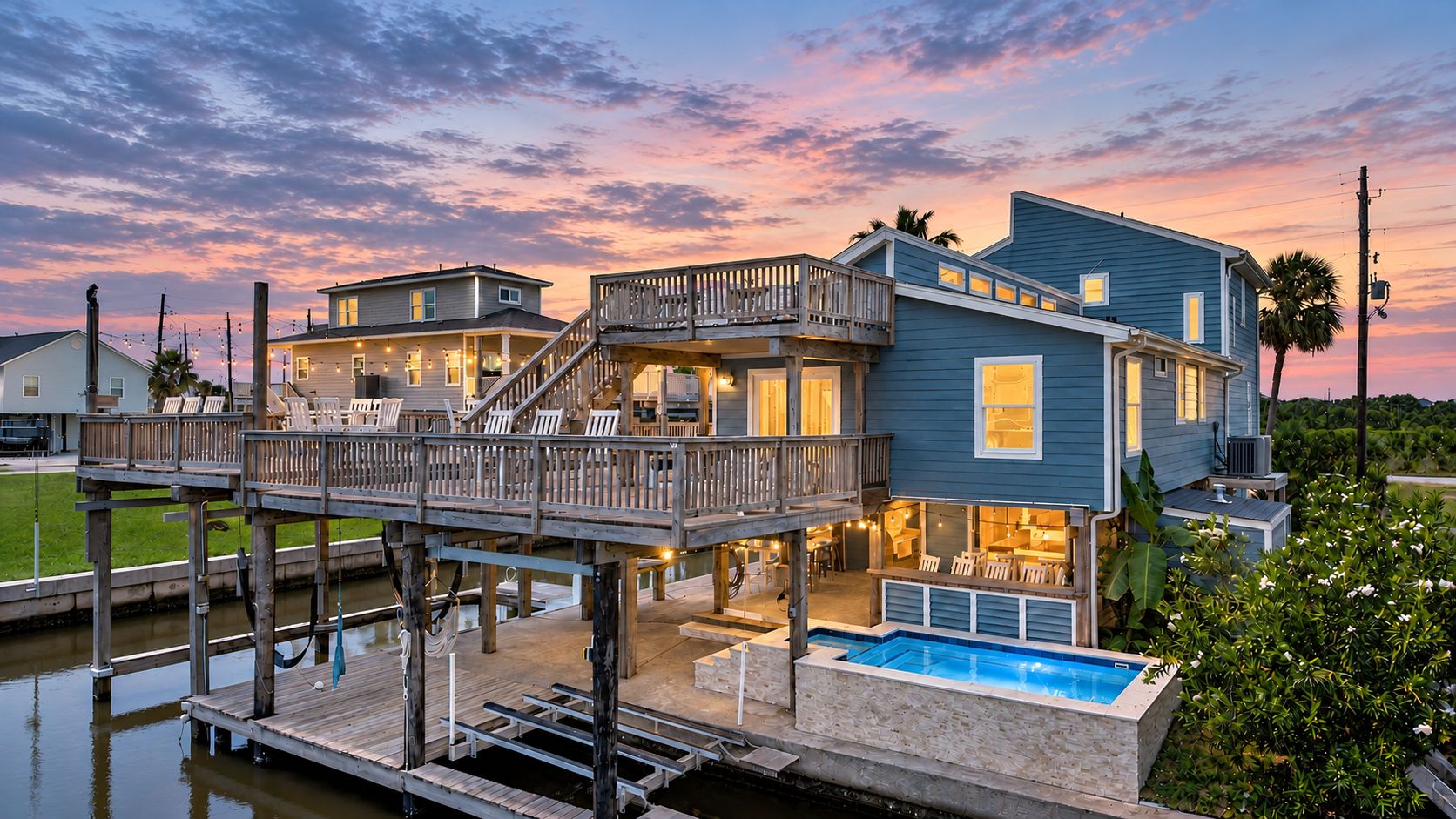 Beautiful canalfront home featuring expansive decks, covered outdoor spaces, and direct waterfront access, ideal for enjoying the coastal lifestyle.