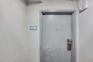A white door with a number plate '633' and a keyhole lock. - Large 1BR unit  with Balcony at Caravelle Tower (Myrtle Beach)
