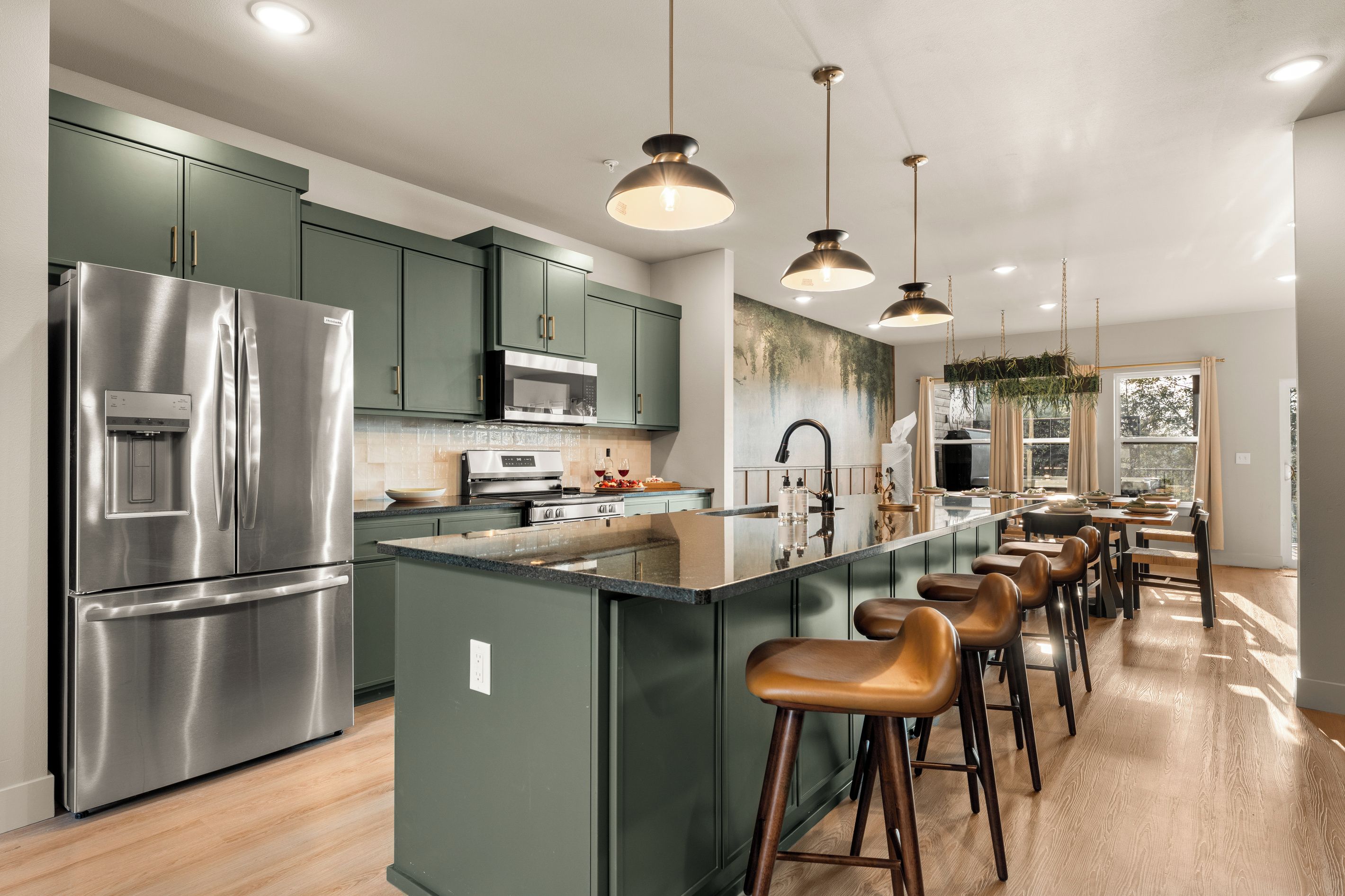 Pull up a stool at the oversized kitchen island for breakfast, snacks, or conversation.