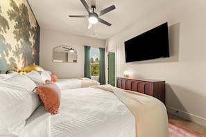 A dramatic woodland mural, plush king bed, and warm designer details create a peaceful retreat after a day exploring Branson. - Enchanted Landing | NEW • Private Indoor Pool (Branson)