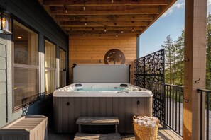 Slip into the private hot tub beneath the covered deck and relax in your own tucked-away outdoor retreat.