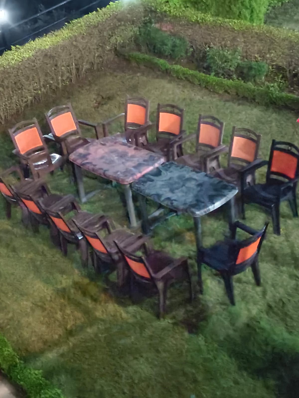 An outdoor seating area with a table and chairs arranged around it.