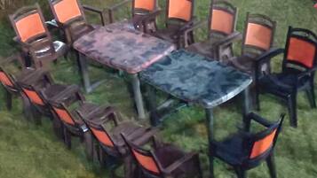 An outdoor seating area with a table and chairs arranged around it.