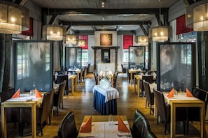 Gather for a candlelit meal in this inviting dining hall.