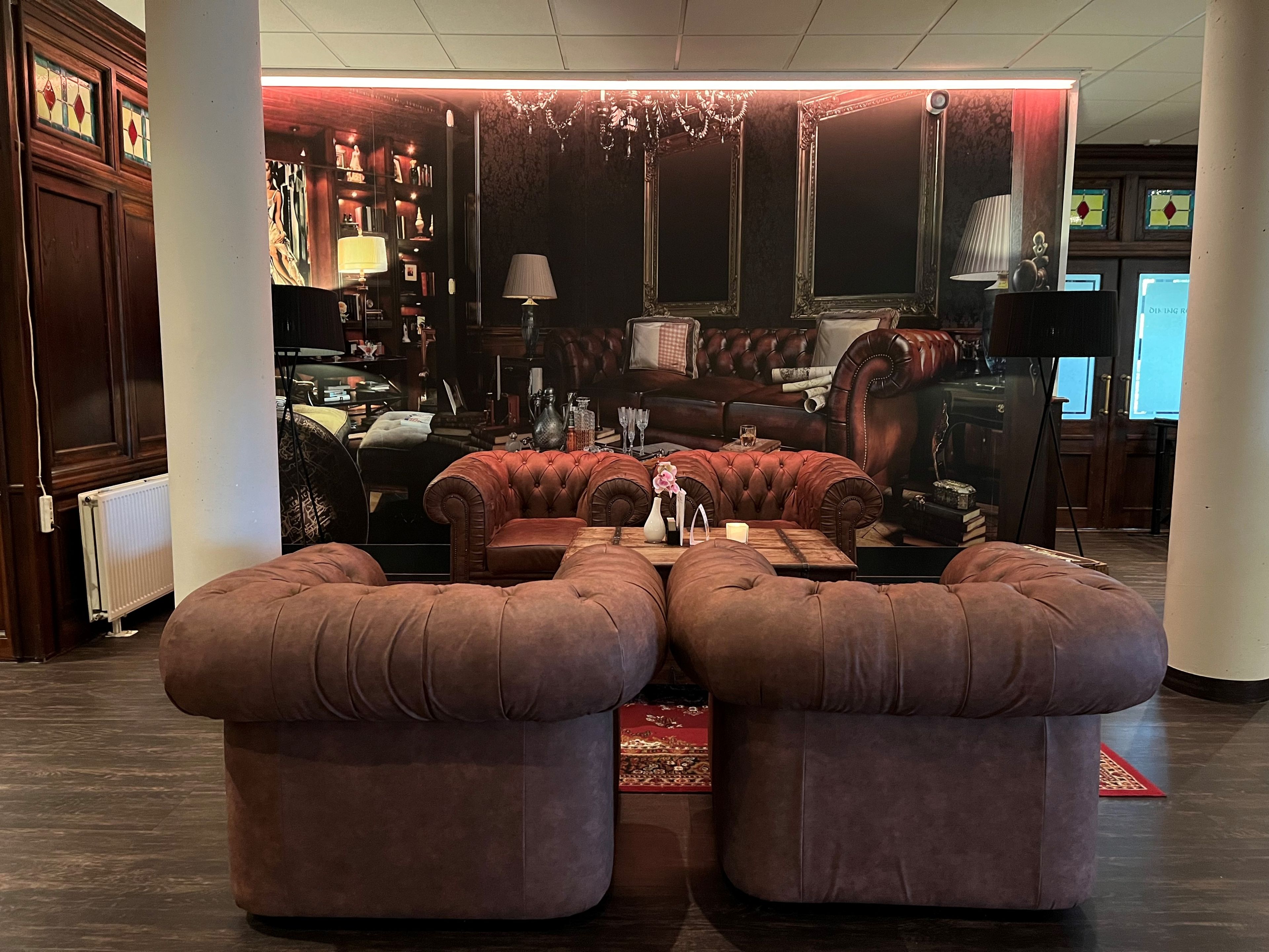 Unwind into leather sofas with candlelit, club-style ambiance.