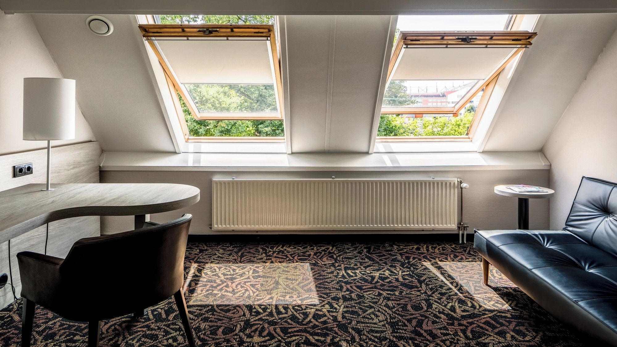 Settle in with a bright workspace and relaxing sofa nook.