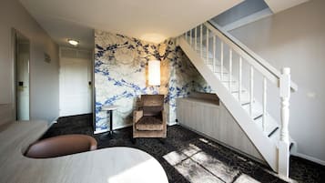 Unwind in the stylish lounge nook beneath the staircase.